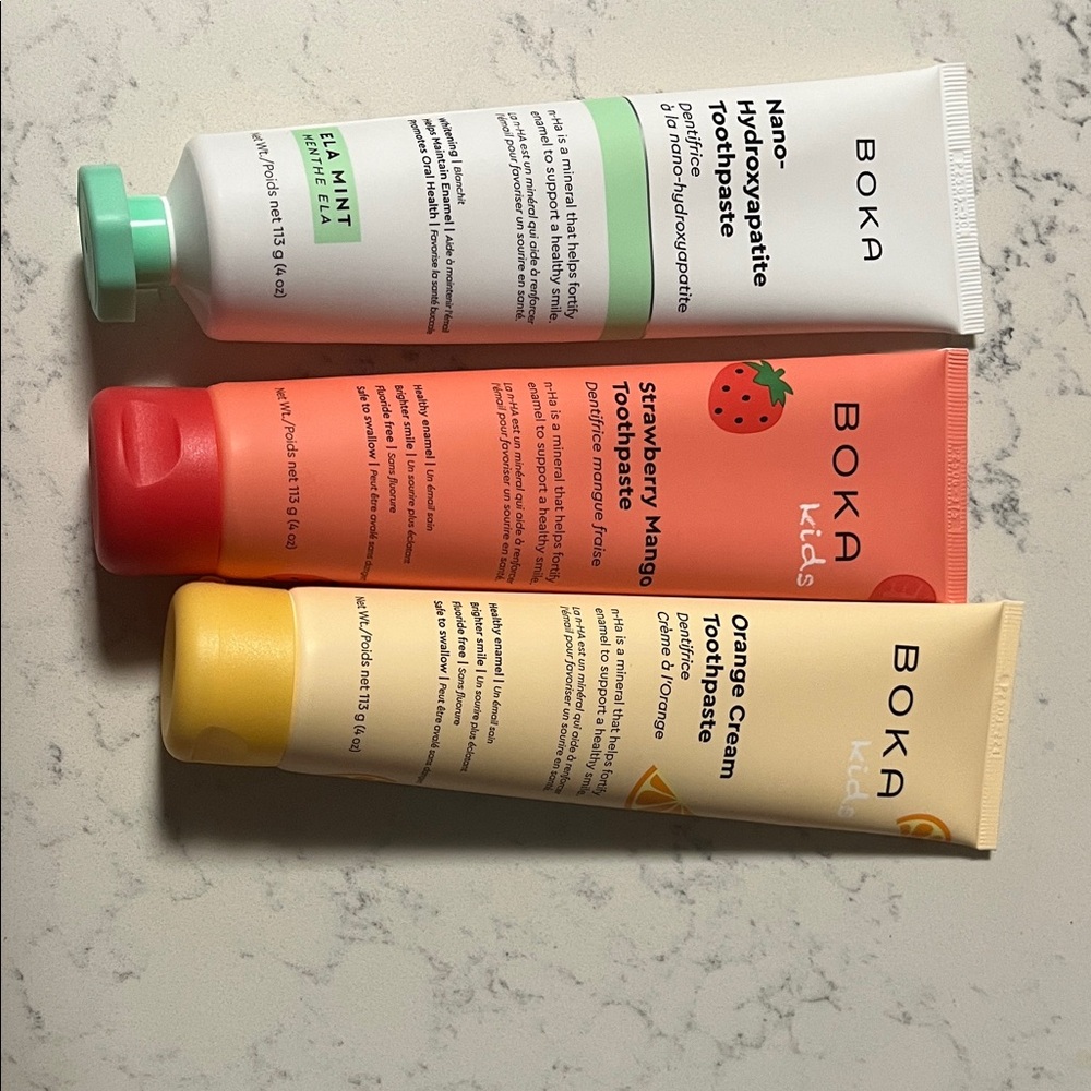 3 tubes of Boka tooth paste. Strawberry is kids.